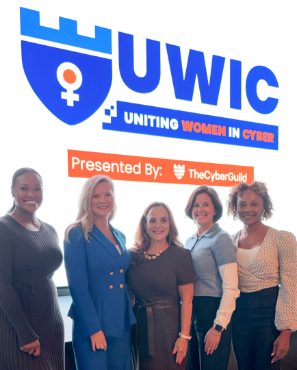 Attendees gathered at Uniting Women in Cyber 2025, held at Amazon HQ in Pentagon City, with speakers and participants engaging in discussions on cybersecurity, innovation, and workforce diversity.