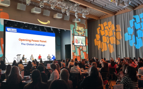 Attendees gathered at Uniting Women in Cyber 2025, held at Amazon HQ in Pentagon City, with speakers and participants engaging in discussions on cybersecurity, innovation, and workforce diversity.