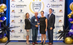 Dave Tohn of BTS Software Solutions receiving the Cybersecurity Award from Senator Katie Hester at the 2025 Cybersecurity Awards.